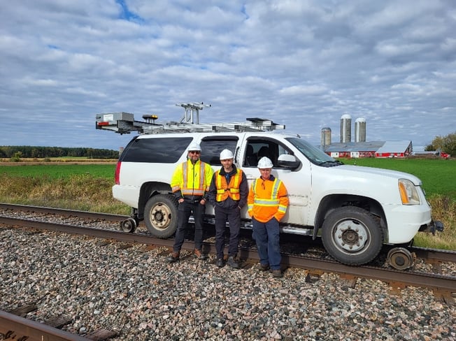 VIA Rail, NRC, CEFRAIL and Pavemetrics field crew beside the LRAIL inspection vehicle in Glen Robertson